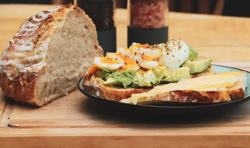 Sourdough bread, slice with avocado, egg, cheese
